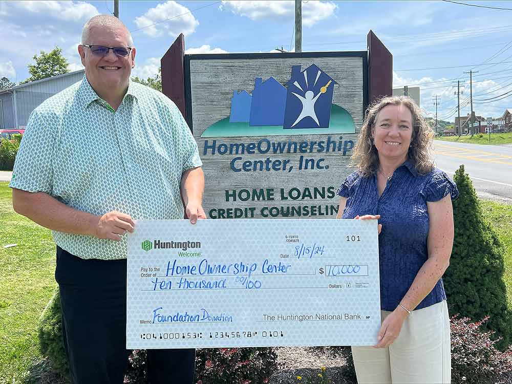 Accepting $10,000 check from The Huntingdon National Bank.