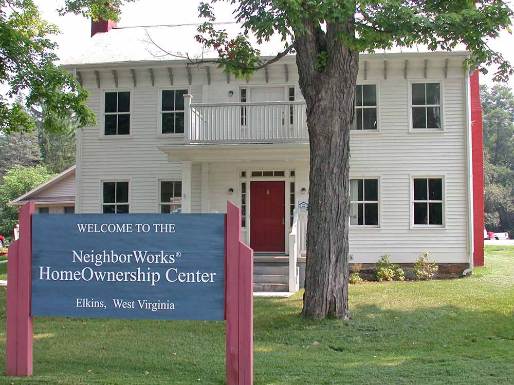 Old Homeownership Center building front with sign.