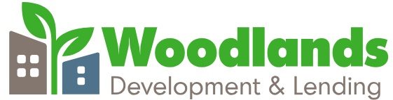 Woodlands Development and Lending logo.